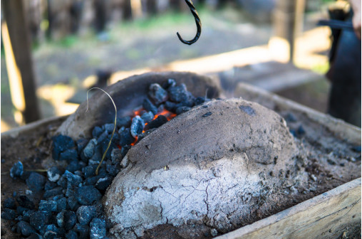 A blacksmith furnace using medieval techniques to create metal objects